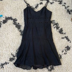 Fitted black eyelet dress